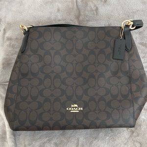 Brown and black couch bag